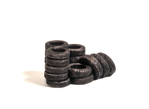 Car Tyres, piled & leaning